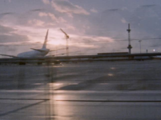 A single airplane sits on the tarmac