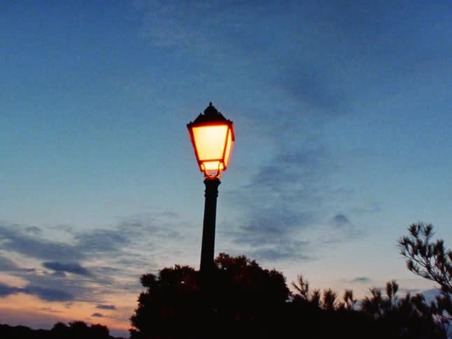 Street lamp against the sky at dusk