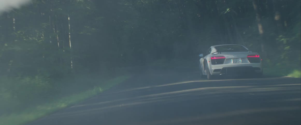 Sports Car Driving In The Early Morning