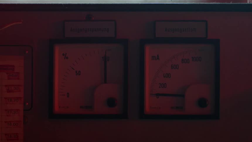 A needle on an electric meter quickly goes from zero to 120 as a red light flashes