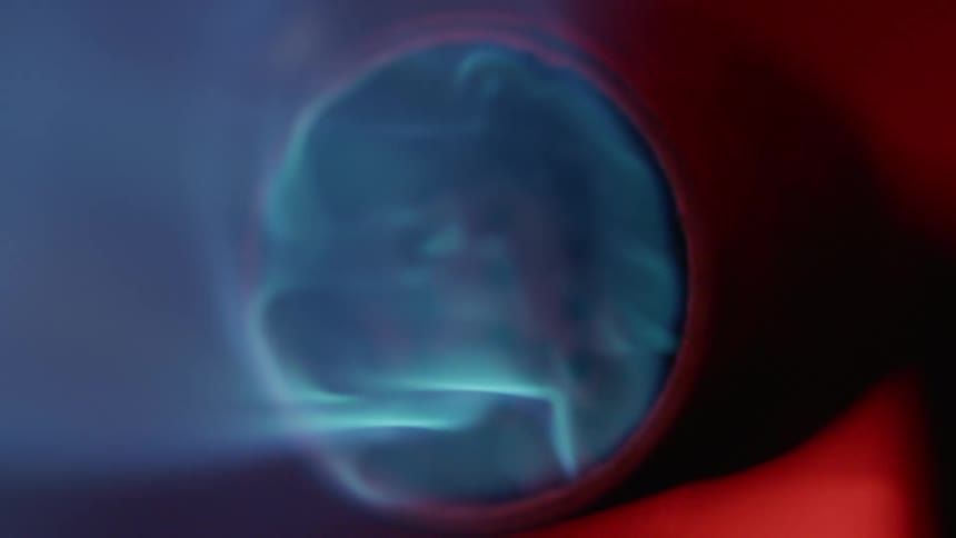 Close up of the burner nozzle of a torch flaming up