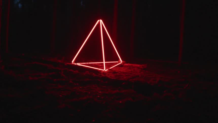 A lit up neon cone outside