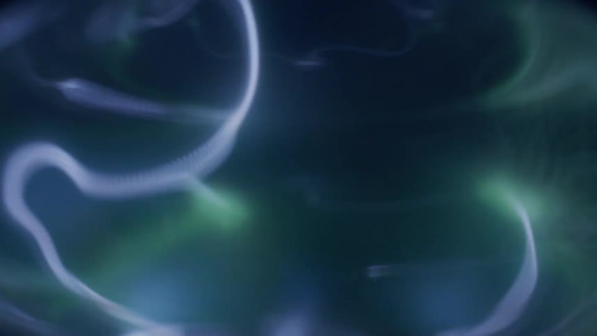 Green and blue lights moving like electric arcs