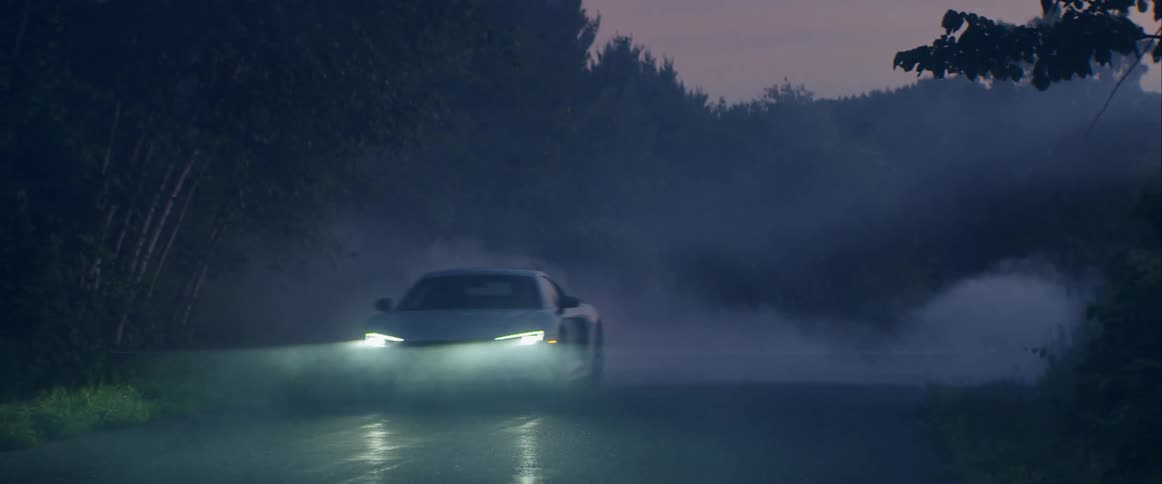 Sports Car Driving In The Early Morning
