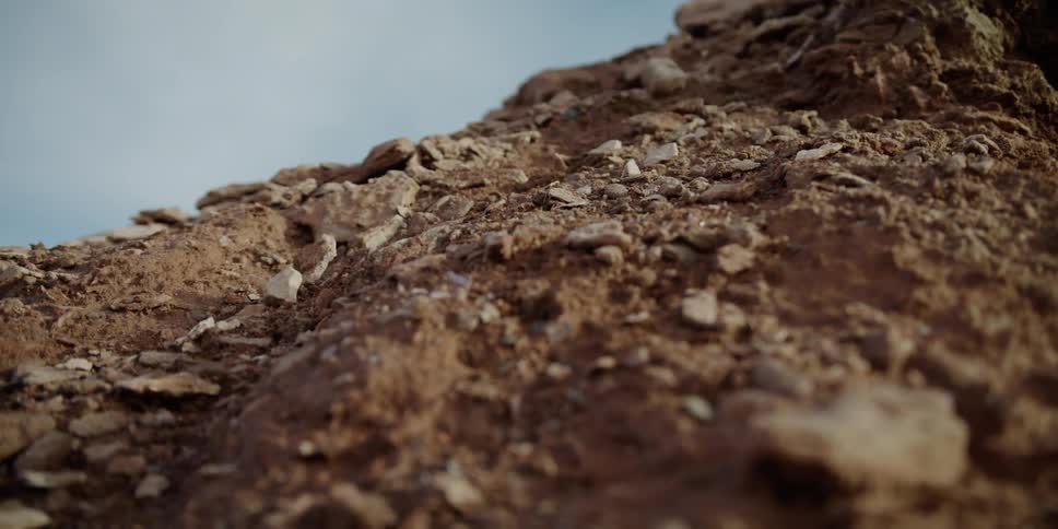 Rocks fall down a cliff
