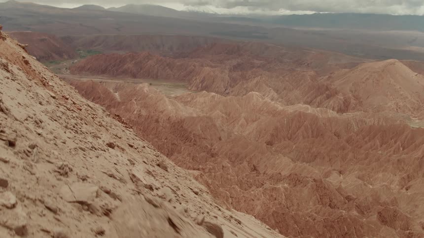 Large mounds of dirt form near a canyon