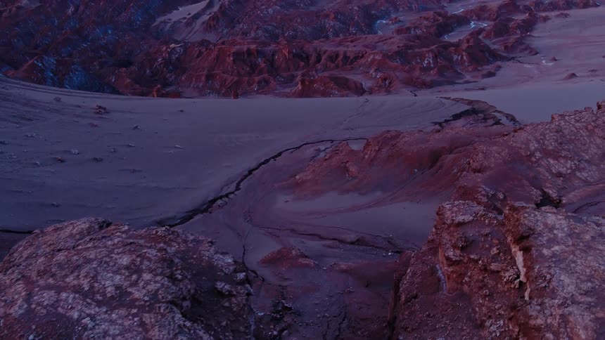 A valley with a giant crack in the soil in the badlands