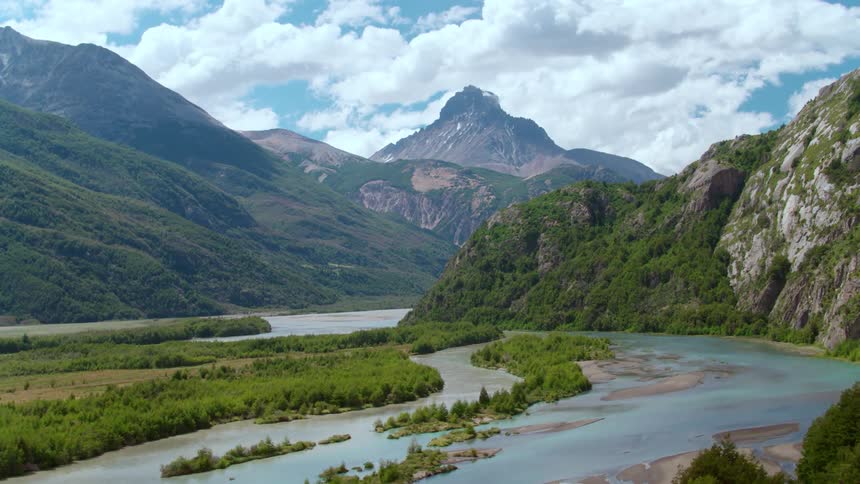 The river water is blue by the mountain