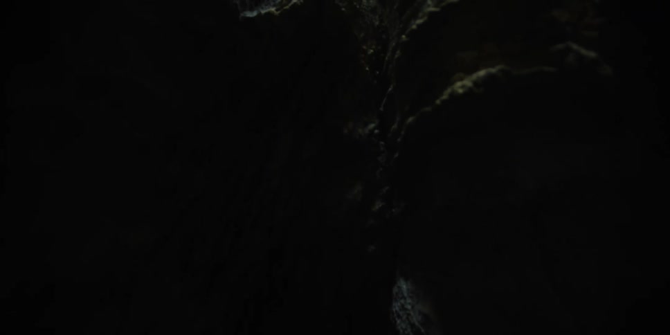 Interior walls of a dimly lit natural cave