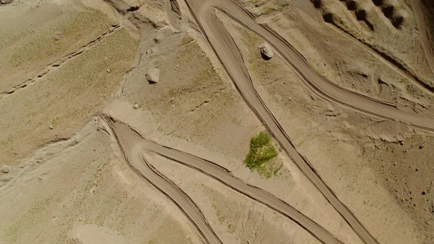 The sand has small hills made at the edge