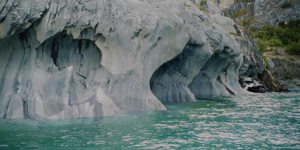 A ridge of rocks line the shore