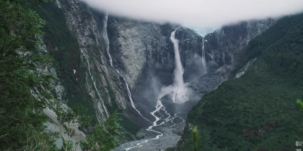 Waterfall streaming on the side of a mountain