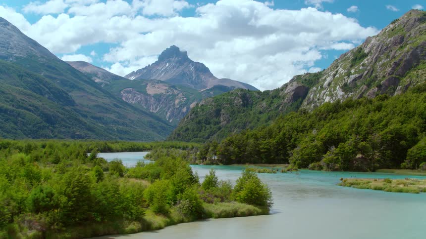 A turquoise river runs through a canyon