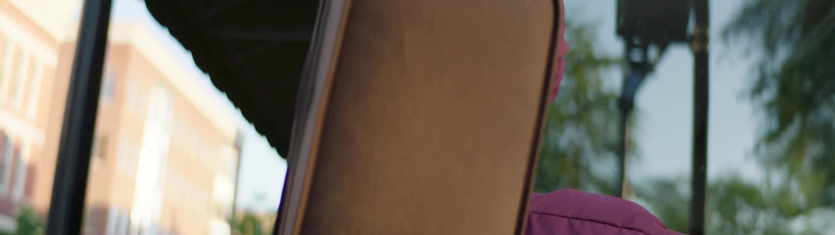 A man is lifting his guitar case