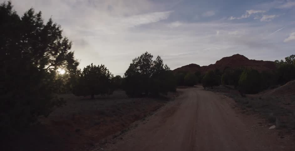 A dirt road is displayed outdoors