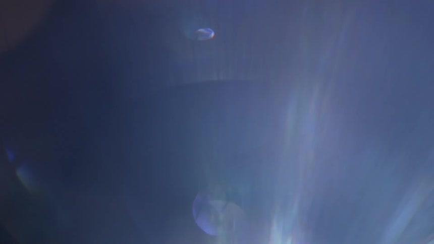 White purple and gray colors that looks like light shining and water droplets