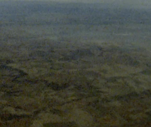 A desert with the sky in the background