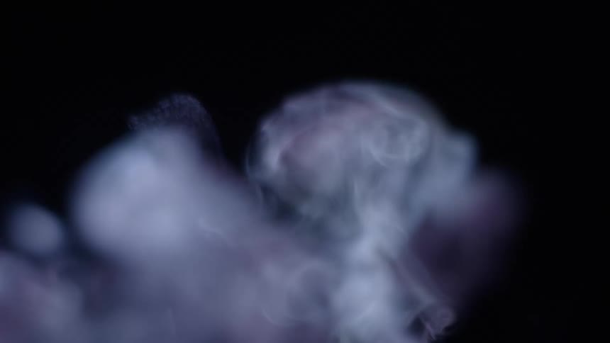 The smoke moves in the dark