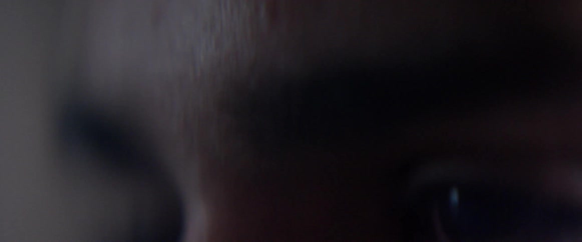 A pair of eyes with movement and light flashing across them