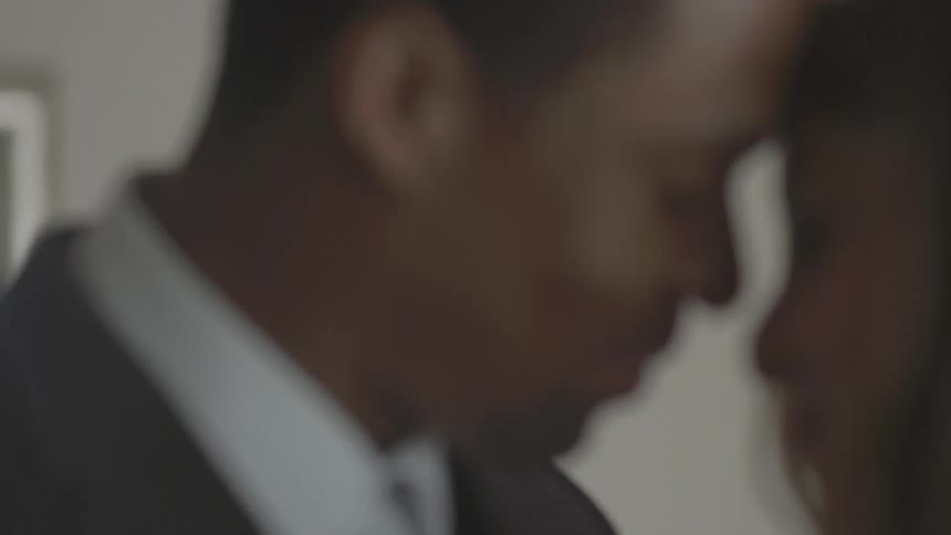 A man and woman talk then embrace each other
