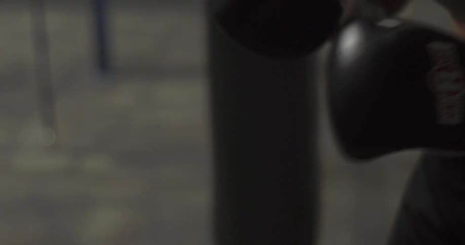 A man punches a punching bag