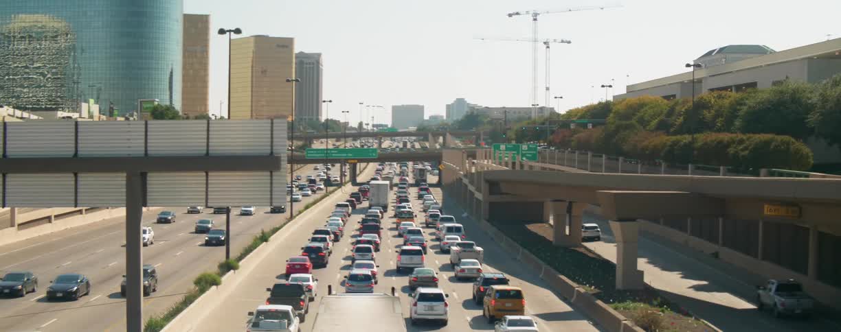 Commuters driving in traffic on the freeway in the city
