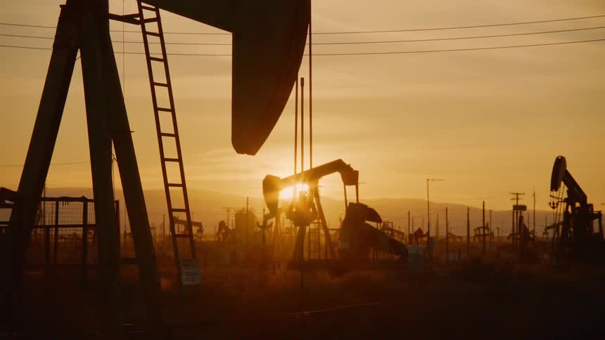 An oil rig pumps for oil in a field