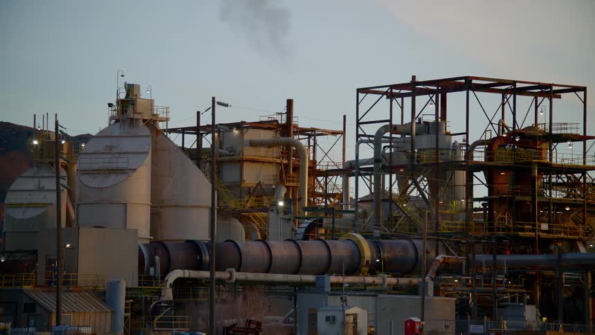 A man walking outside a factory