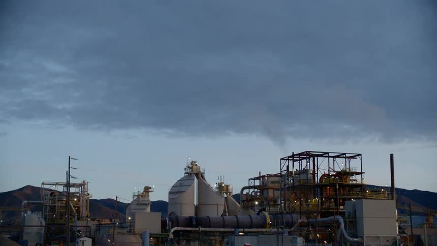 A wide view of a factory at dusk