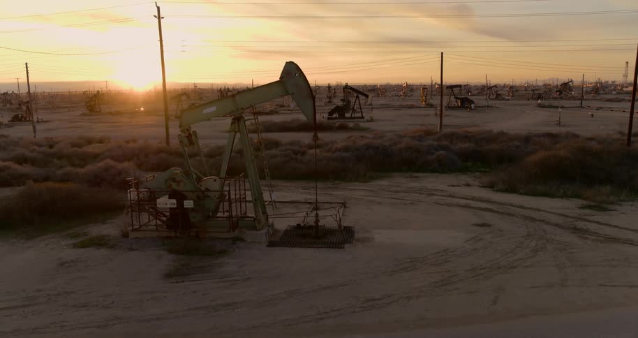 The oil rig sits in the middle of the power lines
