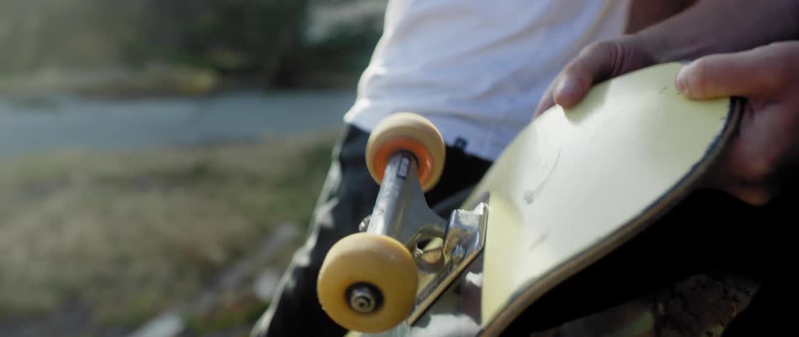 Two young man hang outside the house with skateboards in hand