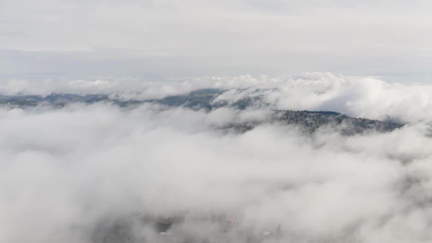 An aerial view of clouds is displayed