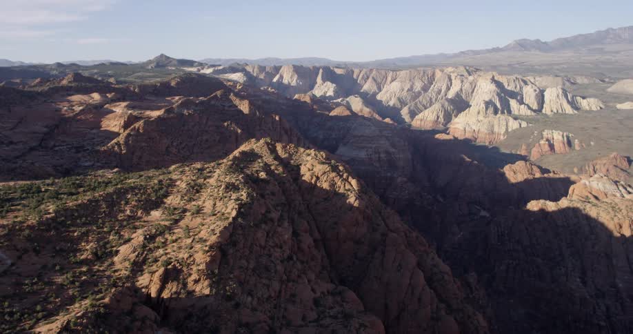 A canyon sits near mountainous terrain