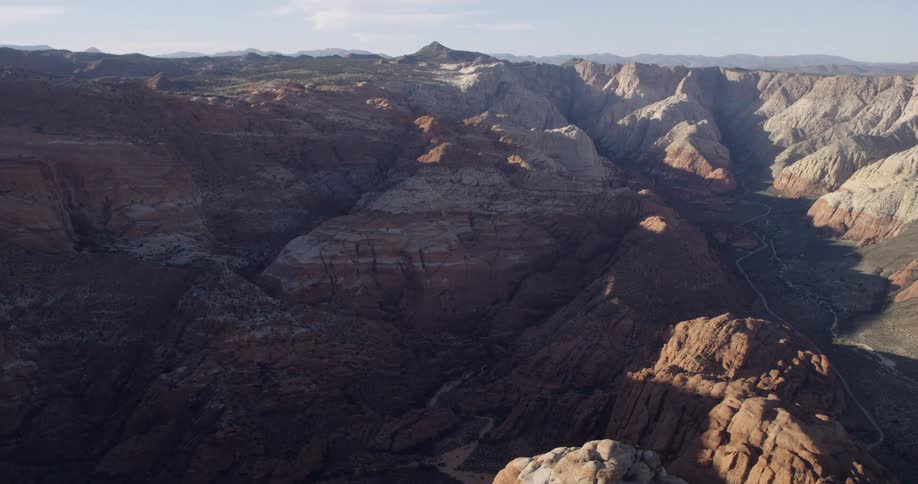 A large mountain range stretches off to the horizon
