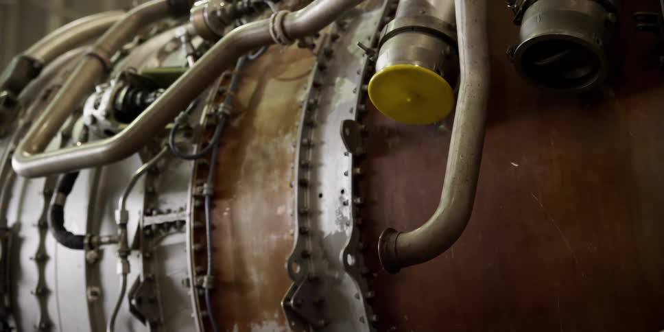 A drum has hoses and wires on the side