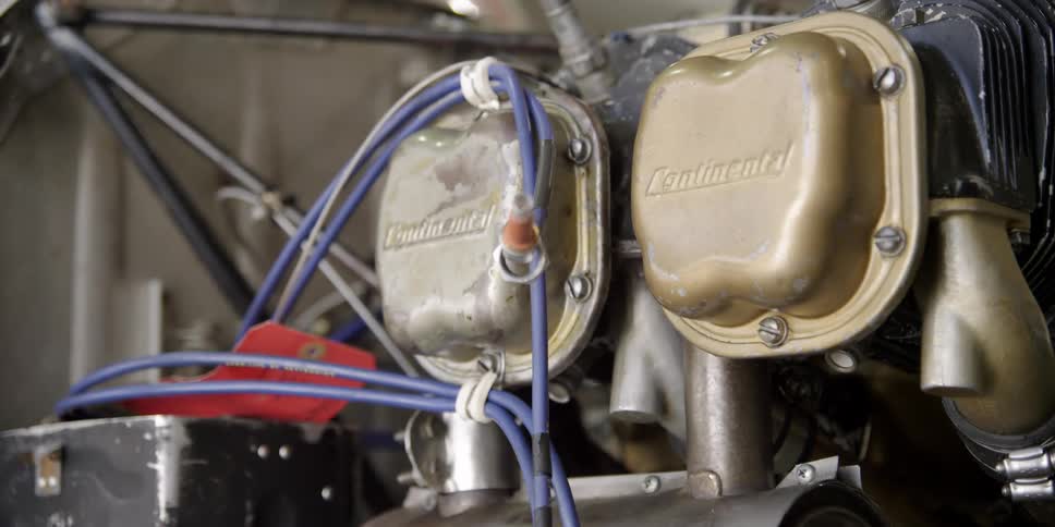 Blue cables run to different parts of an engine