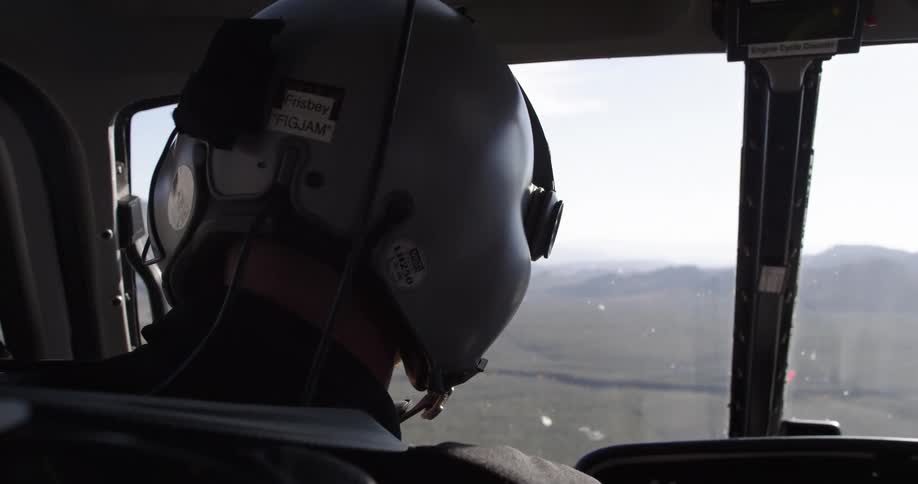 A person is driving a helicopter