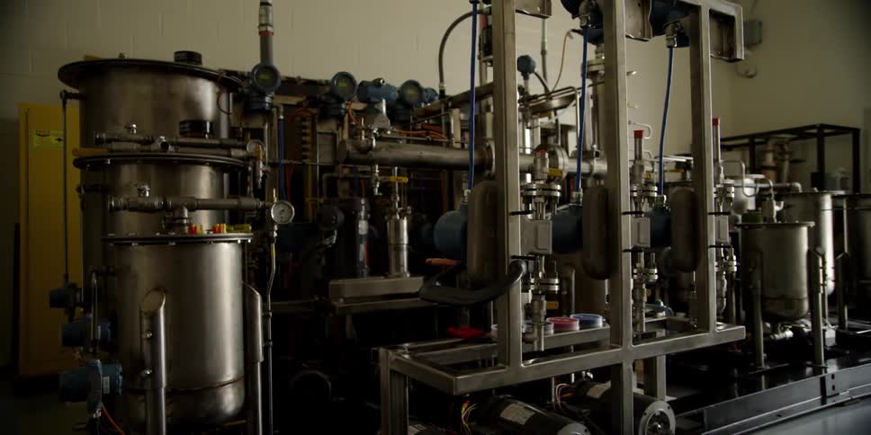 A brewing machine sits in a factory