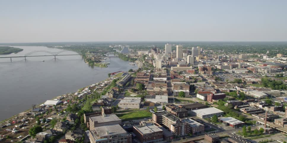 An aerial view of a city with its skyline and canal