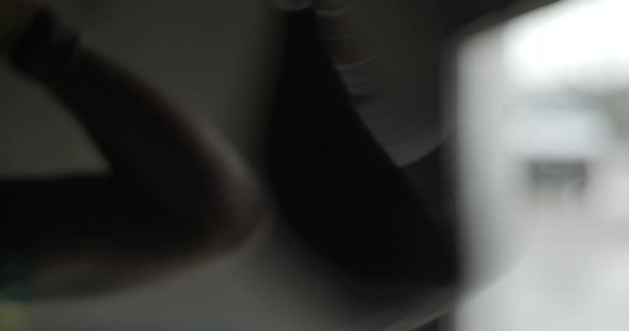 A person is punching a speed bag