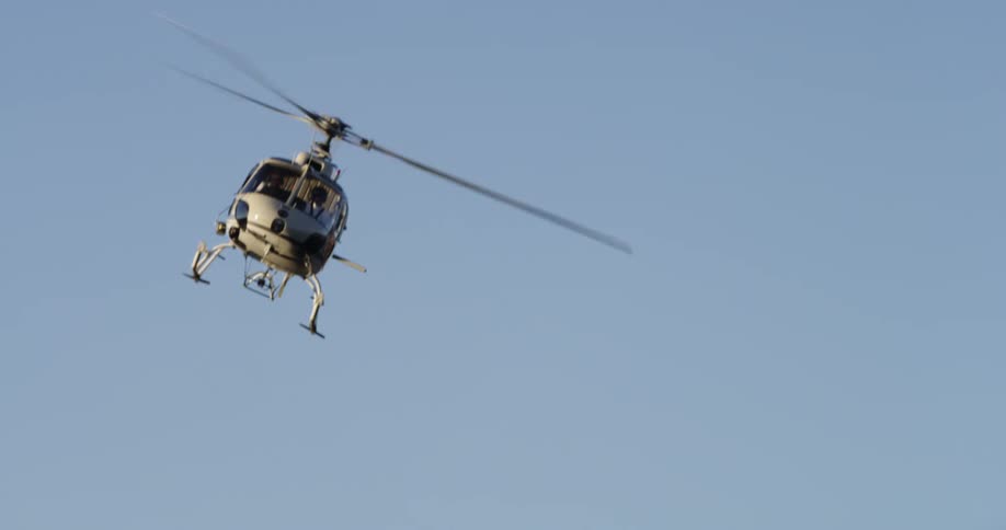 A helicopter flying through the air