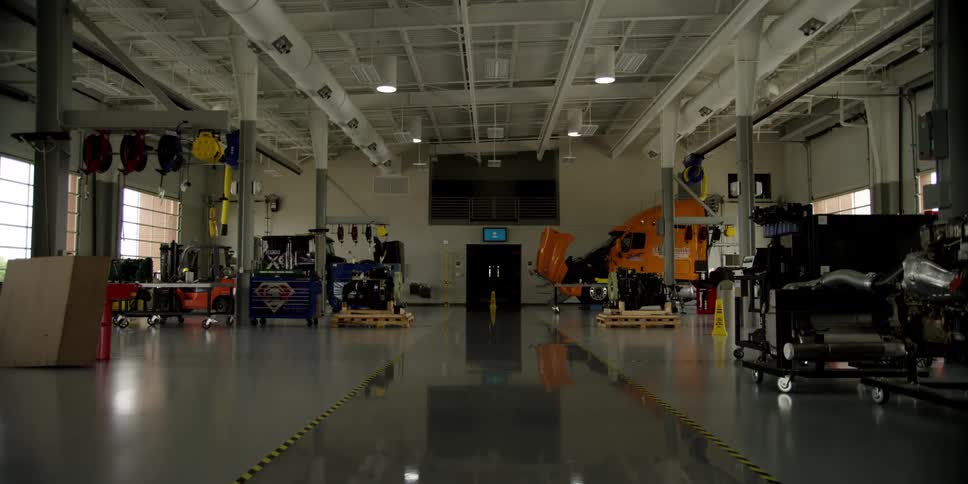 A factory contains machinery and a semi truck