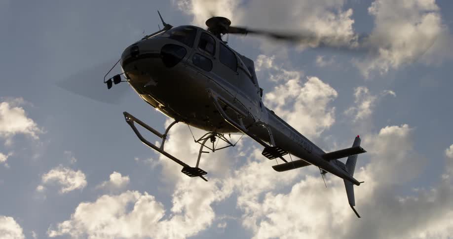 A helicopter hovers in the sky
