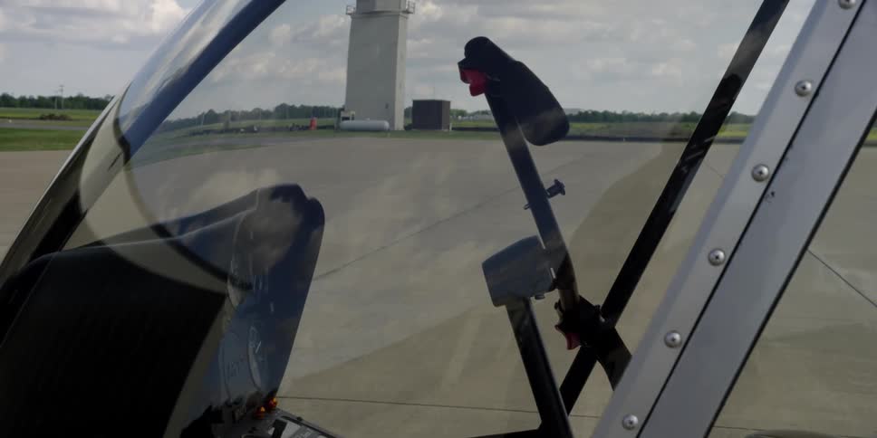 A helicopter sitting on the tarmac at an airport