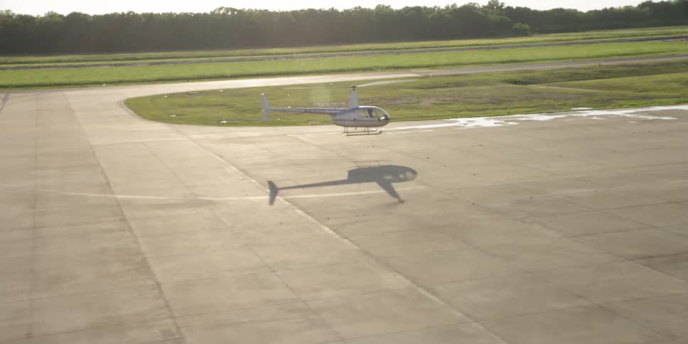 Helicopter hovers over the airfield