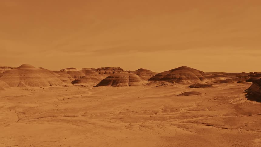 Mounds rise up from a desert