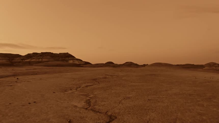 A barren countryside under a brown sky in Mars