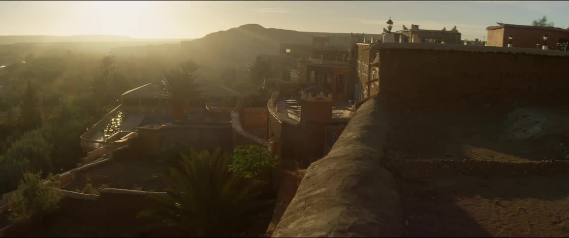 The sun is rising behind the mountains