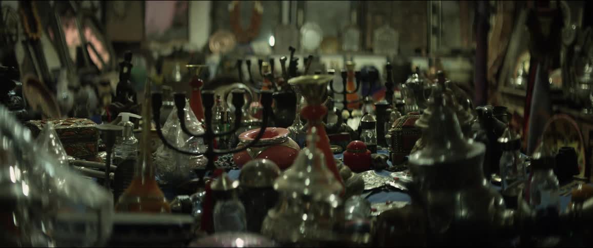 A store has metal goods piled everywhere on a table