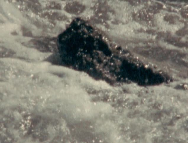 Water is crashing into the rocks